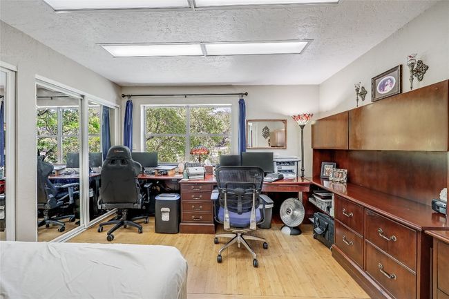 Just off the Kitchen, double pocket sliding doors are the entrance to the 3rd bedroom, currently utilized as an Office. | Image 30