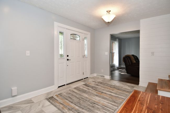 Front foyer leading to living room on circular floor plan | Image 8