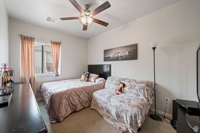 Bedroom featuring carpet and ceiling fan | Image 24