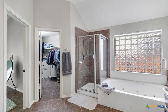 Glass block above jetted tub | Image 26