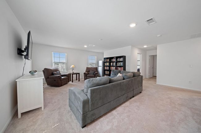 This open area is perfect for a family room, game zone, or quiet retreat. | Image 18