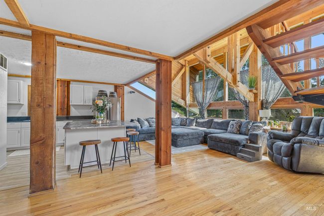 Living room featuring light wood-style flooring | Image 9
