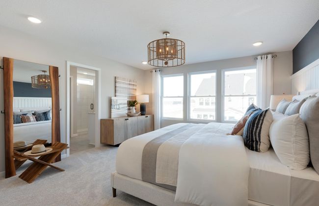 Huge windows and ample space make the Ashton Primary Bedroom one to remember! Photo of model home. | Image 11