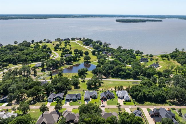 Aerial view of residential area with a nearby body of water | Image 5