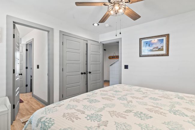 Bedroom with recessed lighting, light wood-type flooring, a closet, and a ceiling fan | Image 22