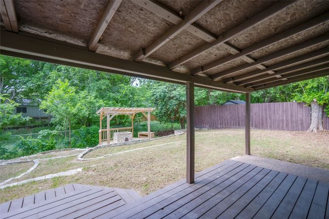 Wooden terrace with a lawn and a fenced backyard | Image 27