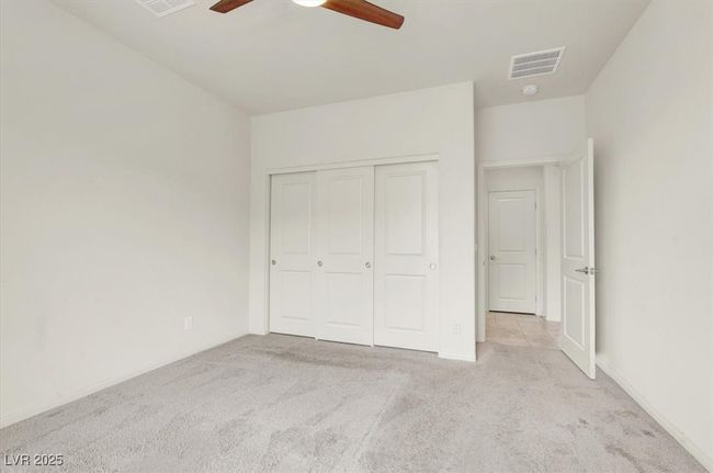 Unfurnished bedroom with carpet floors, a closet, and ceiling fan | Image 30