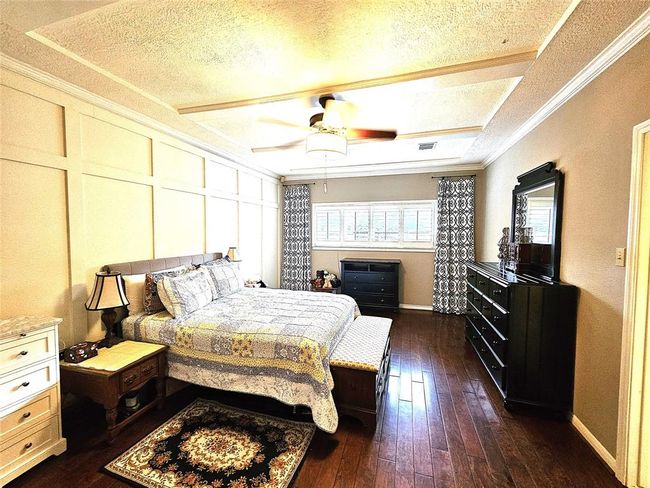 Master bedroom with wood floors | Image 16