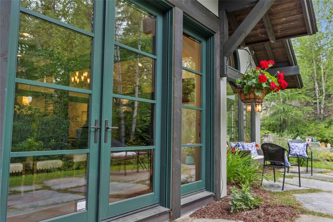 Double doors leading to the patio in the back yard. | Image 15
