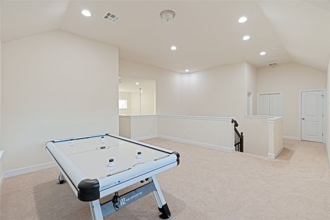 Game room featuring lofted ceiling, light colored carpet, and recessed lighting | Image 27
