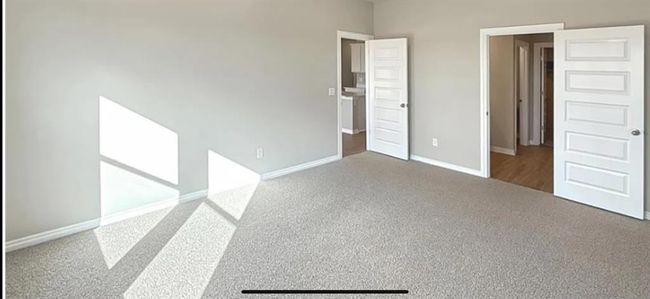 Unfurnished bedroom with carpet and baseboards | Image 11