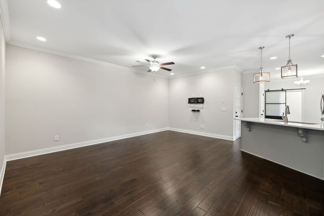 Spacious living room open to kitchen. | Image 4