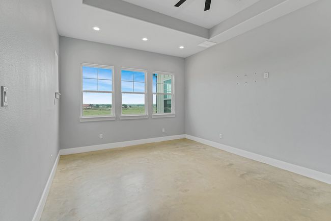 Unfurnished room featuring concrete floors, recessed lighting, a ceiling fan, and baseboards | Image 27