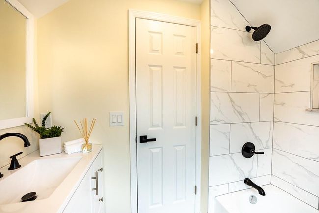 Bathroom featuring shower / bath combination and vanity | Image 31