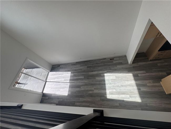Room details featuring baseboards and wood finished floors | Image 24