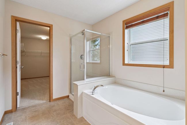 There's also a walk in shower with new glass surround (2025), a soaking tub and a large closet | Image 14