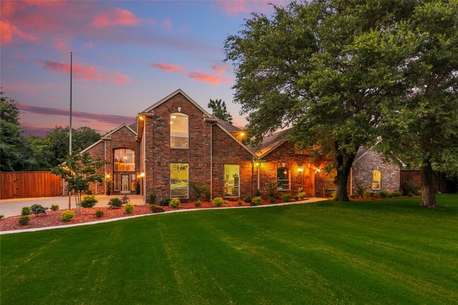 Twilight View of front facade with brick siding | Image 4