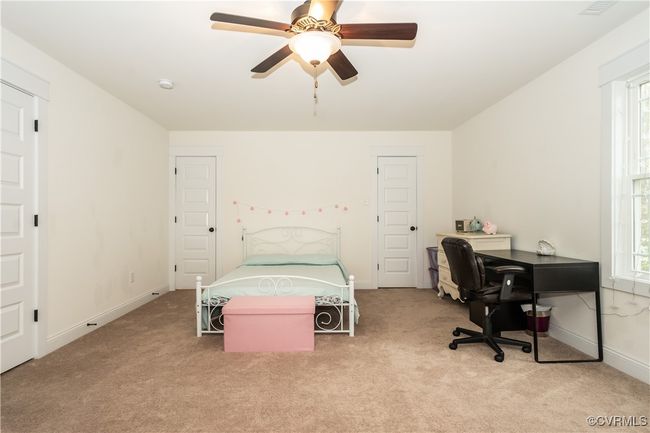 Bedroom with baseboards, ceiling fan, and carpet flooring | Image 24