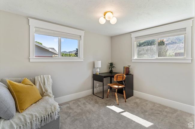 Living area featuring baseboards and carpet | Image 29