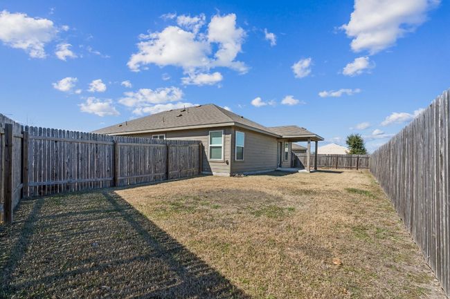 Rear view of property featuring a lawn | Image 22