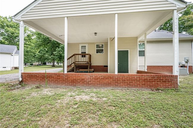 Covered parking with extra room for grilling! | Image 22
