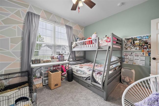 Carpeted bedroom featuring ceiling fan | Image 20