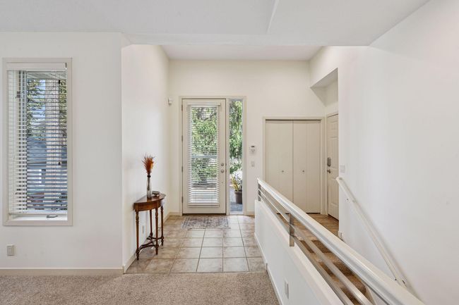 As you enter you will notice the attention to detail with tiled floors and front closet | Image 7