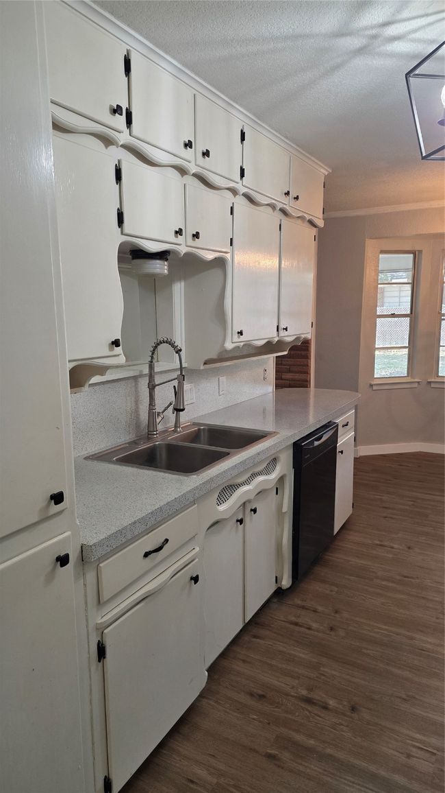 Kitchen featuring an abundance of storage and refinished counters. | Image 5