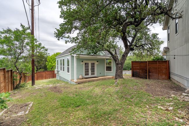 View of side yard looking toward AUD. More garden beds with a fig tree to the left. | Image 31