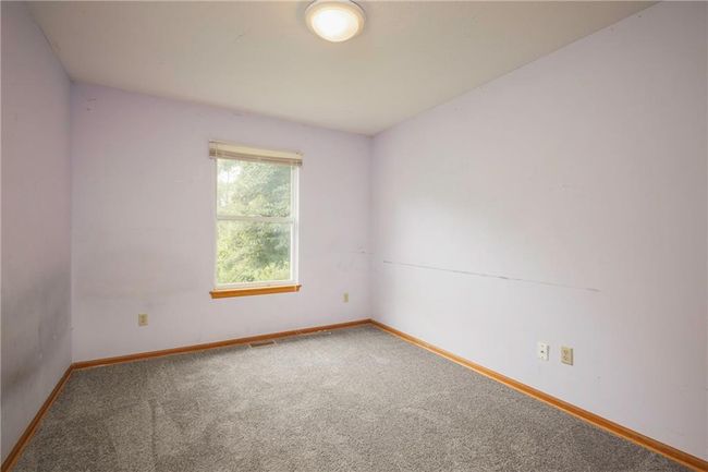 Unfurnished room with carpet and baseboards | Image 23