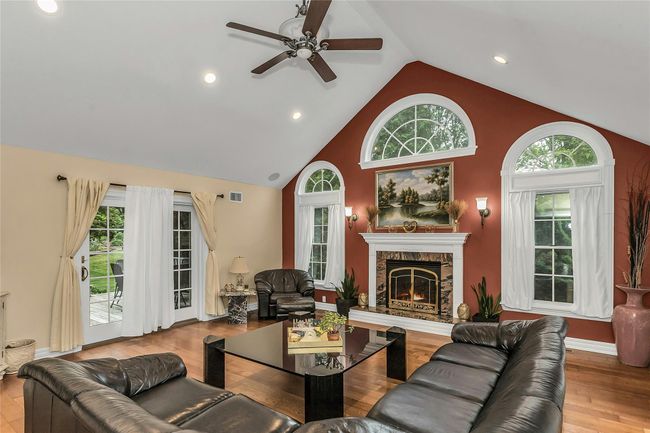 Great Room with Vaulted Ceilings and Fireplace | Image 9