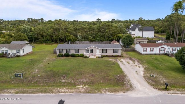 Large driveway, plenty of room for family and friends to come on over. | Image 33