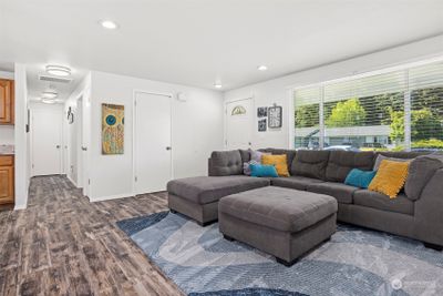 Come on in...There is plenty of room for entertaining and there is a nice coat closet at the front entry. The floors are LVT and really looks great with the white walls and trim. | Image 3