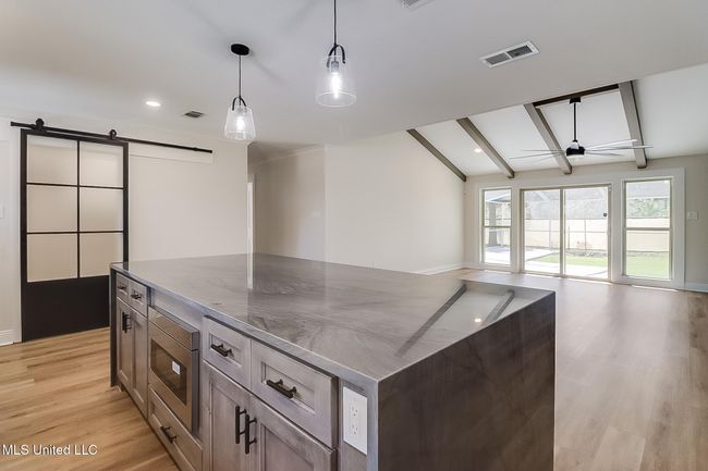 Kit/ Main Laundry Door and Living room | Image 5