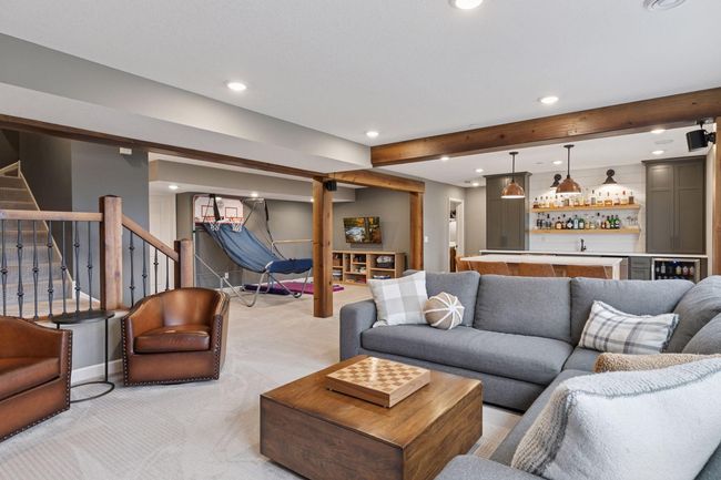 A view of the family room, bar and play room areas | Image 31