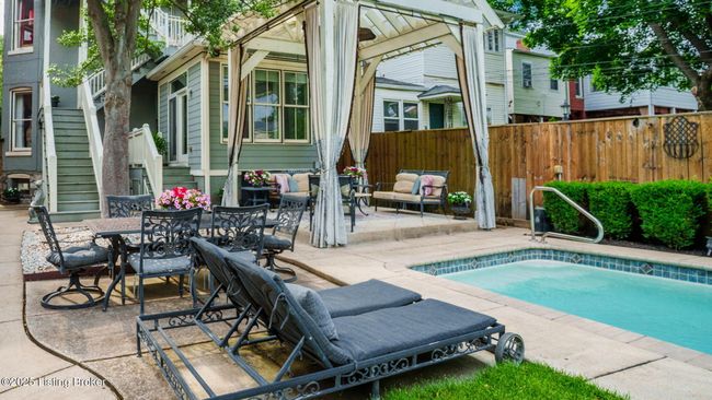 Pool side with pergola in back ground. | Image 45