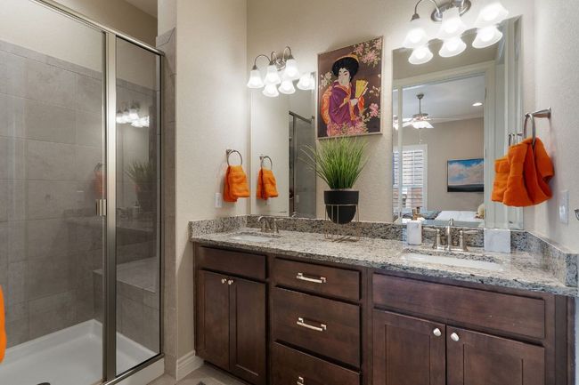 2nd Floor Primary Bathroom featuring double vanity, a stall shower, and a sink | Image 22