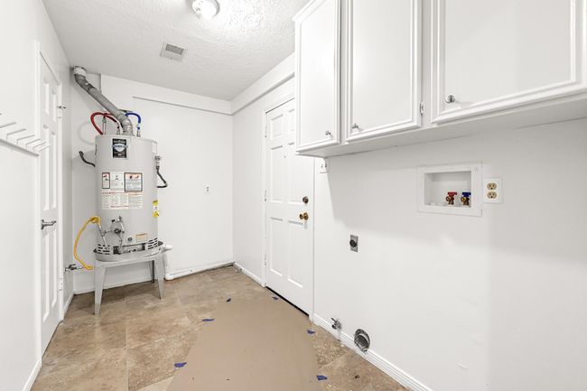 Utility room in house with space for storage. | Image 14