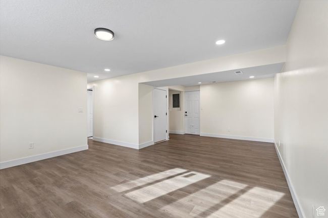 Finished below grade area with recessed lighting, baseboards, and wood finished floors | Image 17