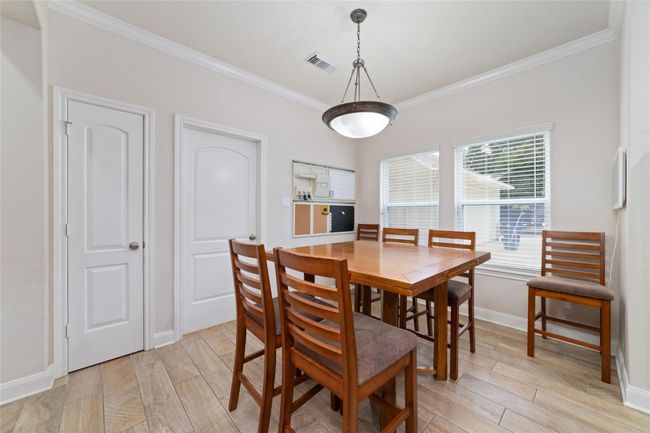 Dining room off of kitchen. | Image 13