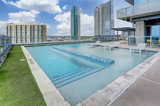View of swimming pool with a patio and a city view | Image 19