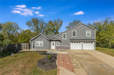 Front of property with a garage and a front lawn | Image 1