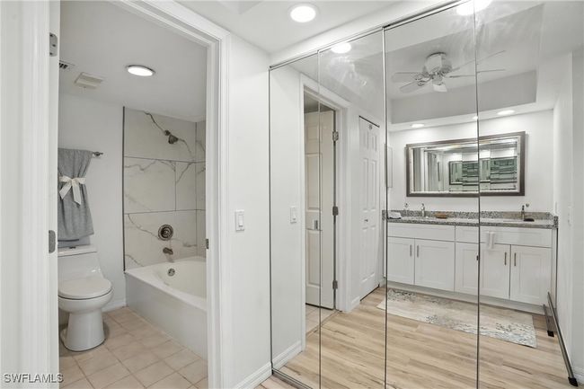 Bathroom featuring double vanity, ceiling fan, shower / bath combination, and recessed lighting | Image 28