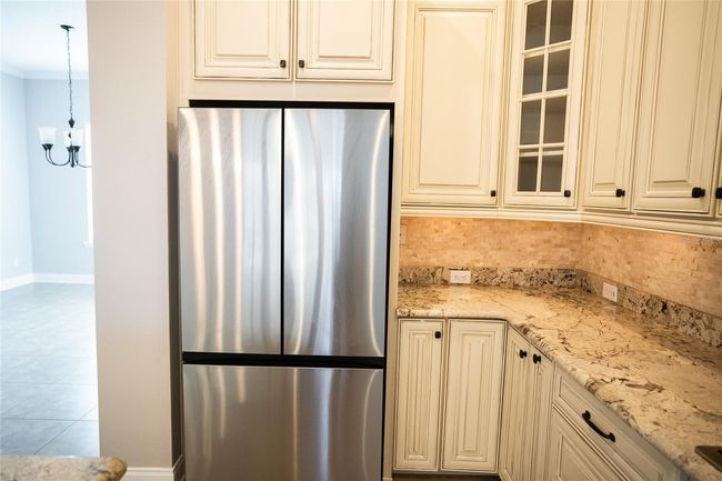 Second floor main living, kitchen, and dining. | Image 15