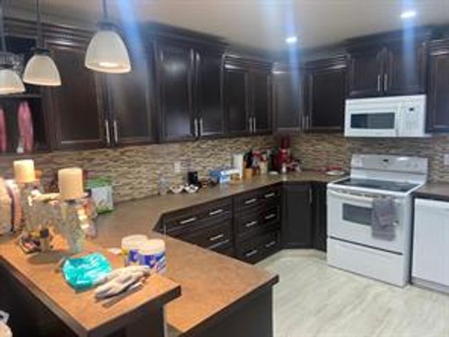328 Penworth Dr Se, House detached with 5 bedrooms, 2 bathrooms and 4 parking in Calgary AB | Image 4