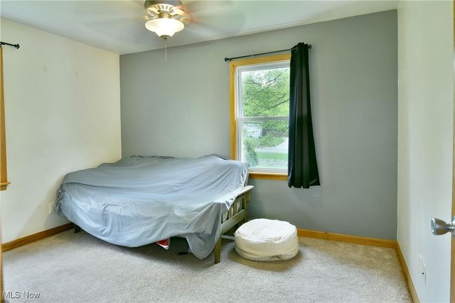 Bedroom featuring carpet, baseboards, and a ceiling fan | Image 28