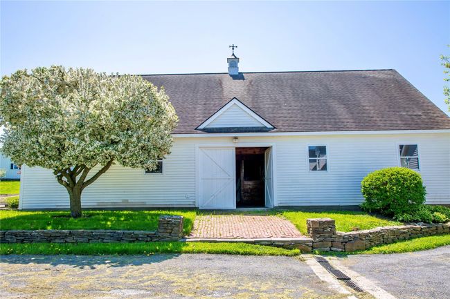 Back of house featuring an outdoor structure, roof with shingles, a barn, and a chimney | Image 28