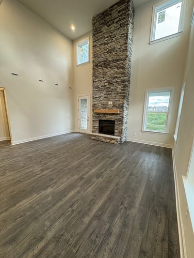 Two story floor to ceiling stone fireplace in great room | Image 2