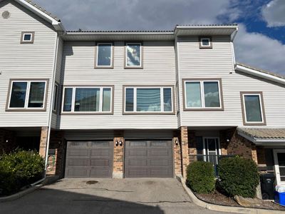 56 Coachway Gdns Sw, Home with 3 bedrooms, 2 bathrooms and 2 parking in Calgary AB | Image 1