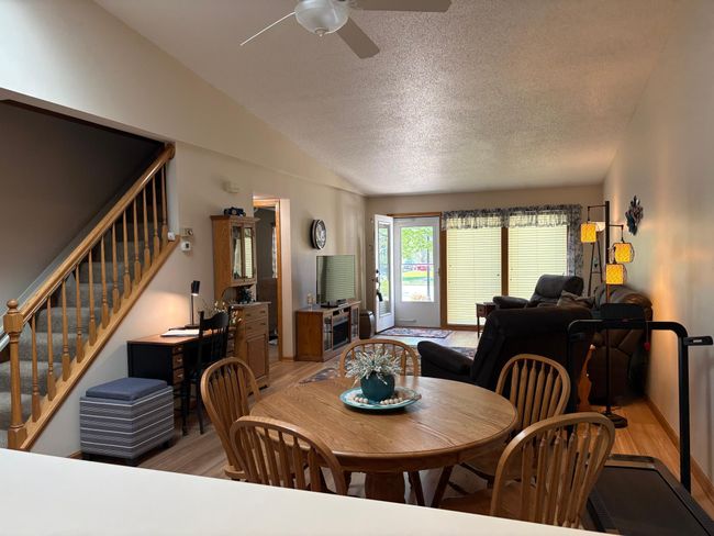 dining and living with steps to 2nd level | Image 18